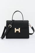 Black Clara top-handle bag, front view with detachable crossbody strap