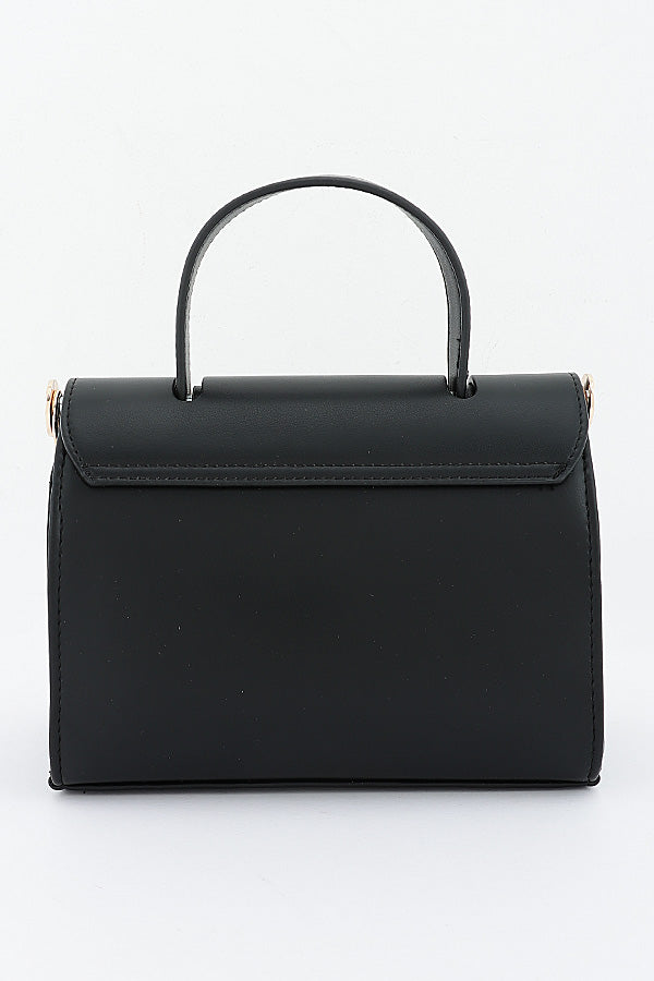Black Clara top-handle bag, angled side view showing its depth
