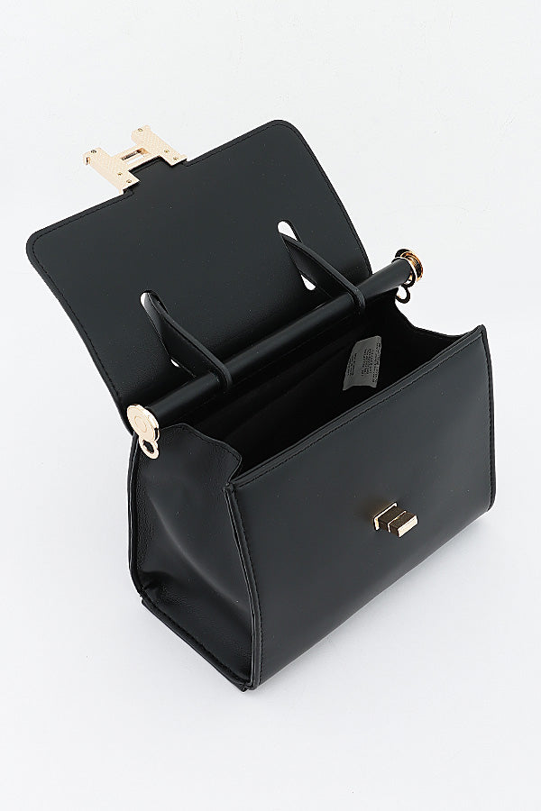 Black Clara top-handle bag opened to show the interior